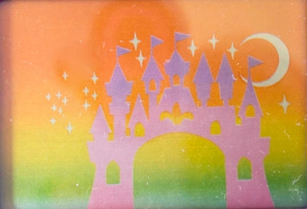 The compact’s original pastel castle and crescent moon
