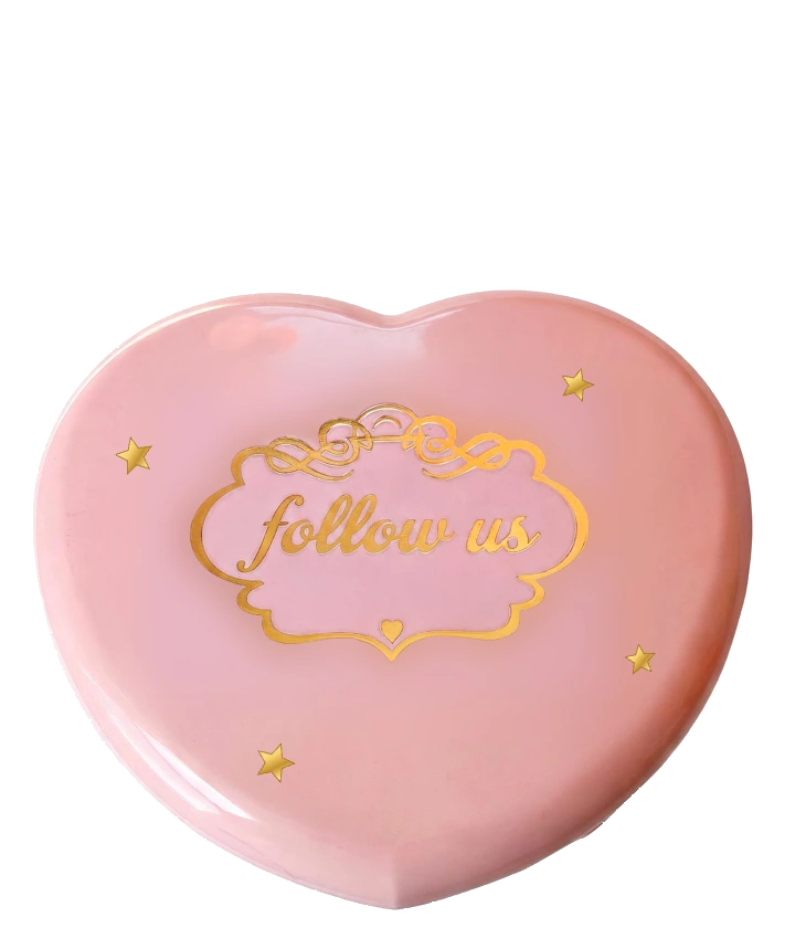 Pink heart compact with gold follow us lettering and four gold stars